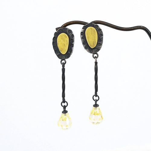 These delicate drop earrings are crafted in silver and 18 carat gold with delicate yellow cubic zirconia drops.