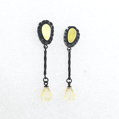 These delicate drop earrings are crafted in silver and 18 carat gold with delicate yellow cubic zirconia drops. By Vaune Mason.