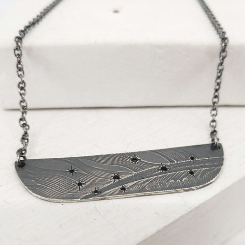 The Matariki Necklace in oxidised sterling silver by NZ jeweller Buster Collins. 