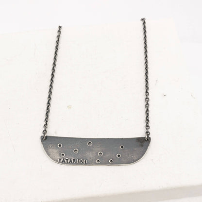 The Matariki Necklace in oxidised sterling silver by NZ jeweller Buster Collins.