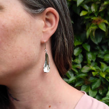 Load image into Gallery viewer, The silver petal earrings by NZ jeweller Buster Collins are simple and sleek easy-to-wear jewellery.
