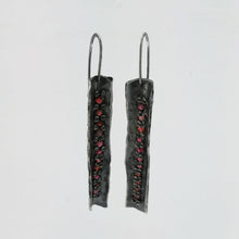 Load image into Gallery viewer, These unique earrings are hand crafted in oxidised sterling silver and set with graduated sizes of garnets. NZ jeweller Vaune Mason is known for her love of colourful gemstones and exciting setting style.

