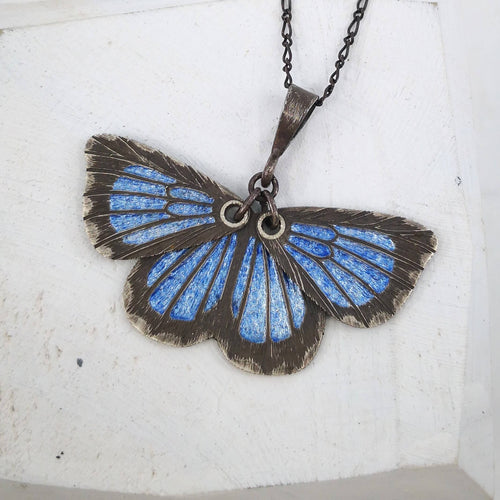 The Southern Blue Butterfly pendant by Adele Stewart in silver and glass enamel. 