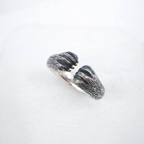 The Bear Hug Ring by NZ jeweller Vaune Mason is hand crafted in solid sterling silver with claws in pollished bronze. 