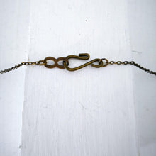 Load image into Gallery viewer, The bronze catch for the Huia Beak charm pendant. Made by The Wild Jewellery NZ.
