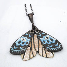Load image into Gallery viewer, The beautiful Gypsy Moth pendant by Adele Stewart features moving wings coloured with glass enamels and set with tiny black diamonds.
