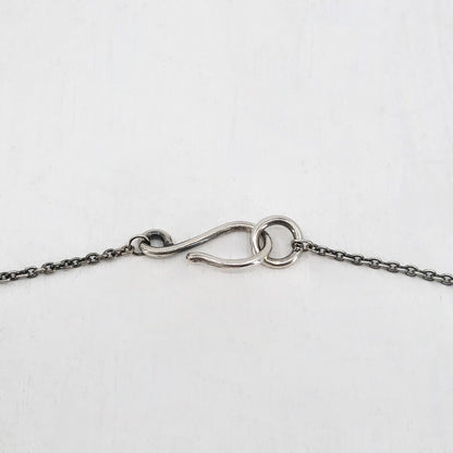 Silver Dog Pendant handmade by Vaune Mason. This cute wee dog hangs from a sturdy solid silver chain. Quality silver jewellery available at Mason and Collins.