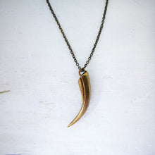 Load image into Gallery viewer, The Huia Beak charm pendant features a small curved beak pendant based on the distinctive curved bill of the now extinct Huia Bird. Handmade in NZ by The Wild Jewellery.
