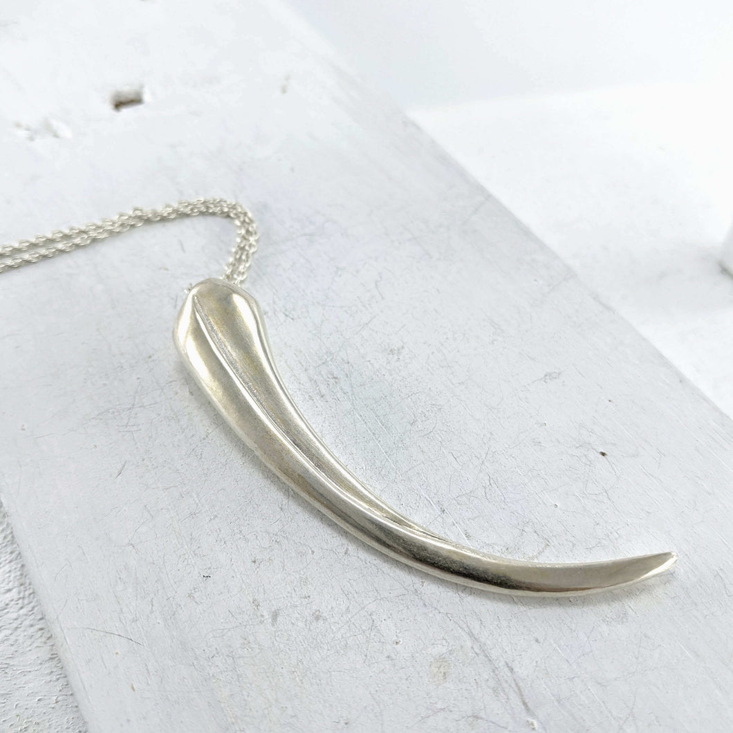 The Huia Beak Pendant in solid sterling silver by The Wild Jewellery. Iconic NZ themed jewellery, handmade in NZ available at Mason & Collins.