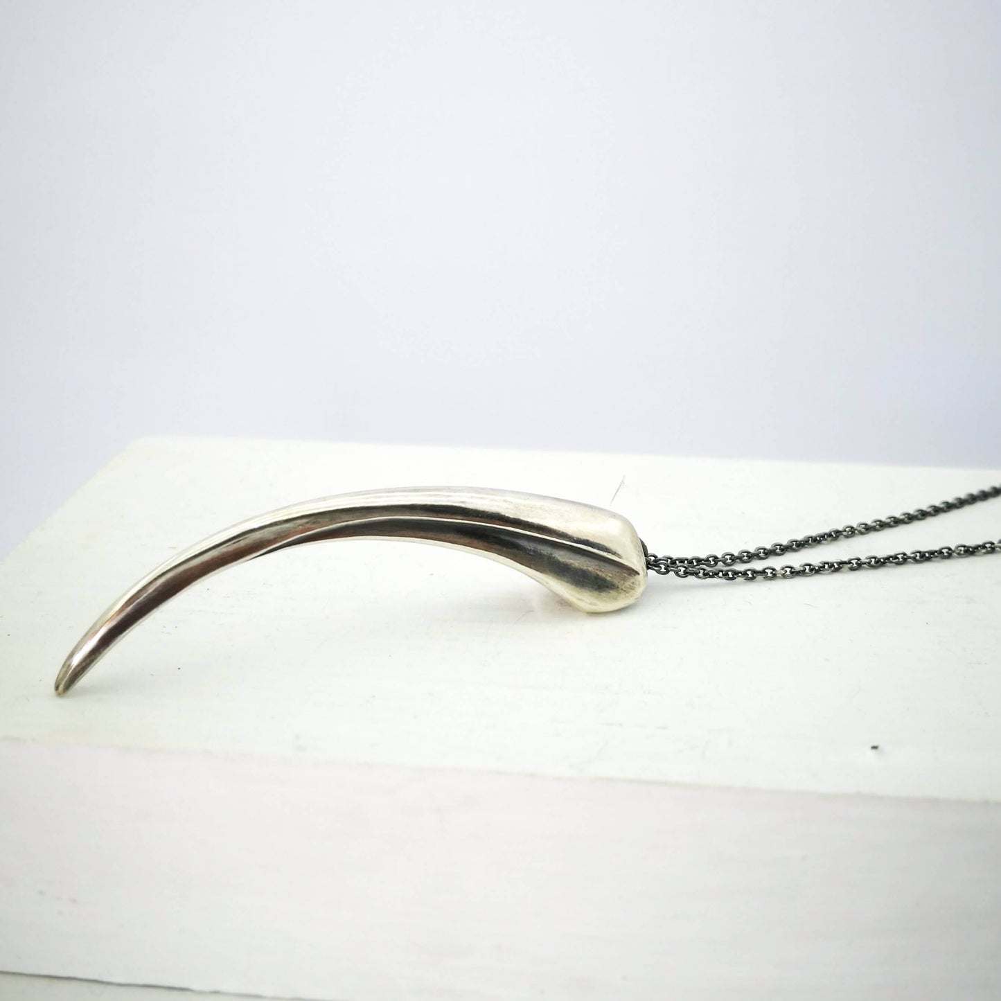 The Huia Beak Pendant in solid oxidised sterling silver by The Wild Jewellery. Iconic NZ themed jewellery, handmade in NZ available at Mason & Collins.