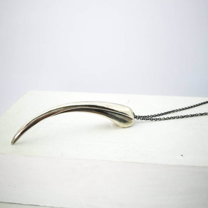 The Huia Beak Pendant in solid oxidised sterling silver by The Wild Jewellery. Iconic NZ themed jewellery, handmade in NZ available at Mason & Collins.