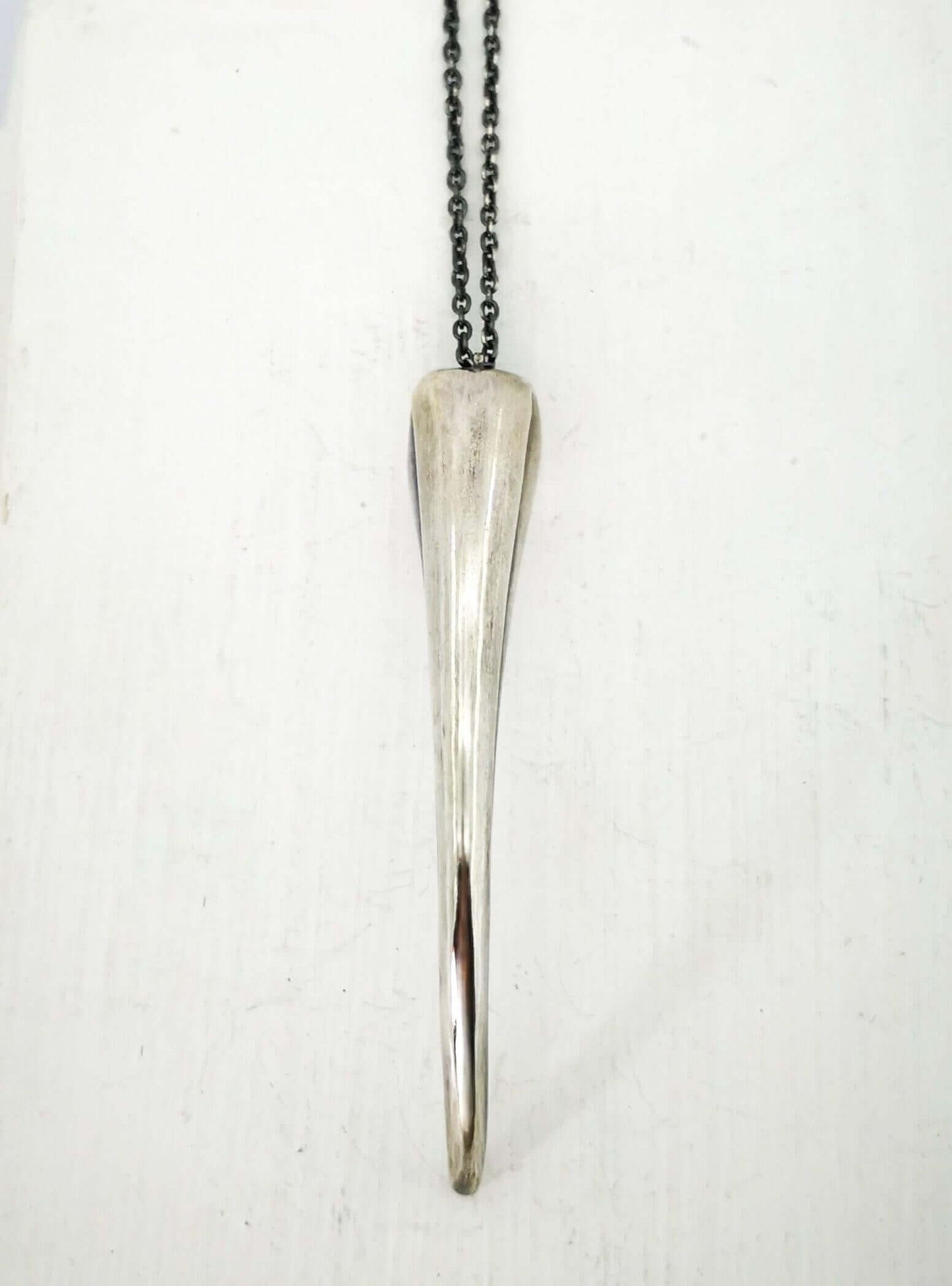 The Huia Beak Pendant in solid oxidised sterling silver by The Wild Jewellery. Iconic NZ themed jewellery, handmade in NZ available at Mason & Collins.