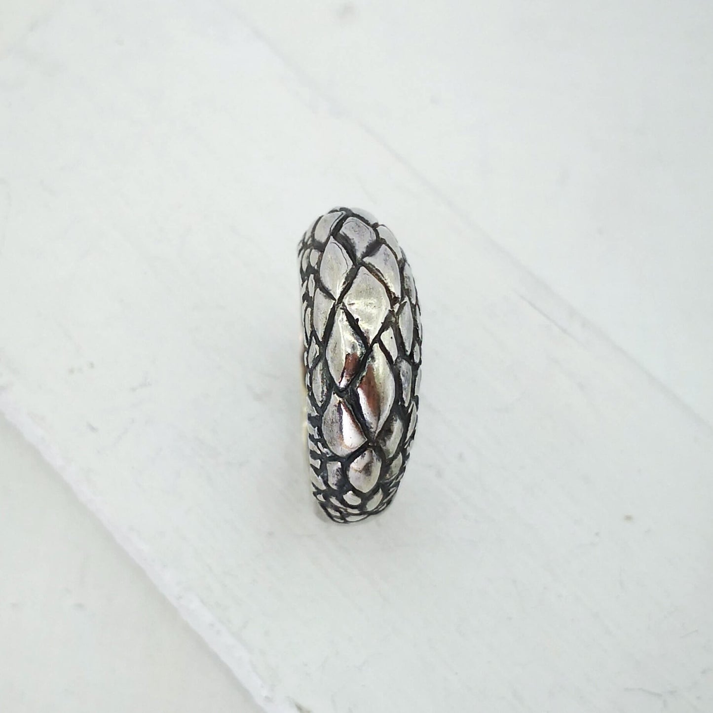 The Tuatara Ring is carved with a scale texture inspired by the skin of the endangered Tuatara. Hand crafted in NZ by The Wild Jewellery.