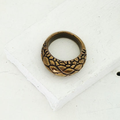 The Tuatara Ring is carved with a scale texture inspired by the skin of the endangered Tuatara. Hand crafted in NZ by The Wild Jewellery.