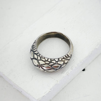 The Tuatara Ring is carved with a scale texture inspired by the skin of the endangered Tuatara. Hand crafted in NZ by The Wild Jewellery.