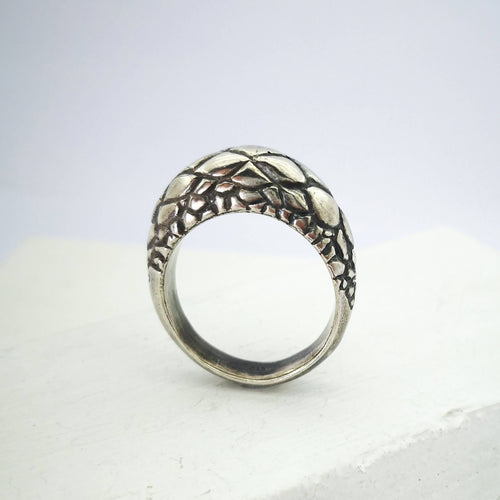 The Tuatara Ring is carved with a scale texture inspired by the skin of the endangered Tuatara. Hand crafted in NZ by The Wild Jewellery.