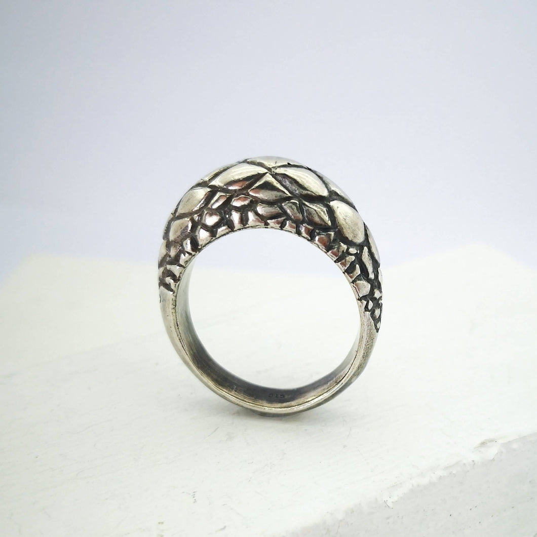 The Tuatara Ring is carved with a scale texture inspired by the skin of the endangered Tuatara. Hand crafted in NZ by The Wild Jewellery.