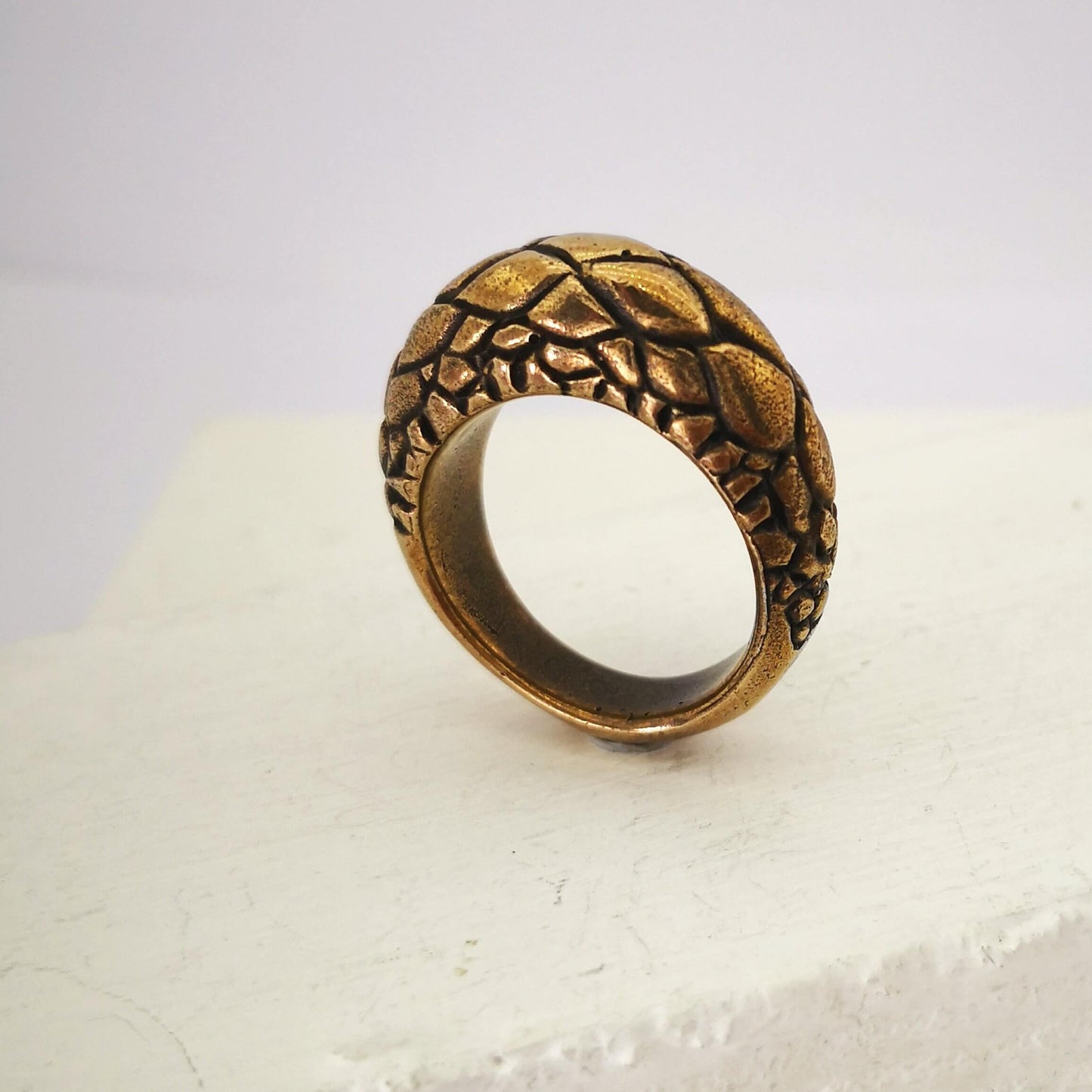 The Tuatara Ring is carved with a scale texture inspired by the skin of the endangered Tuatara. Hand crafted in NZ by The Wild Jewellery.