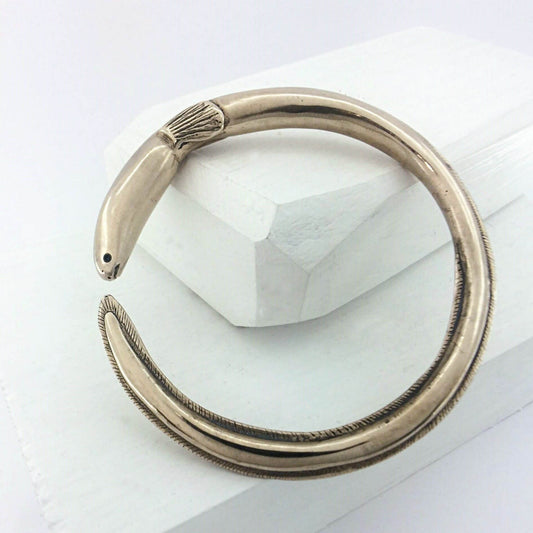 The tuna bracelet is handmade in NZ by The Wild Jewellery. Cast in warm bronze this bracelet represents the endangered long-finned eel that is native to Aotearoa NZ.