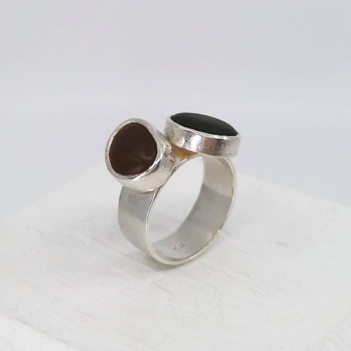 The Two-stone Beach Pebble Ring by Claire McSweeney is hand crafted NZ Jewellery, made using pebbles from Wellington's Seatoun Beach, and solid silver. 